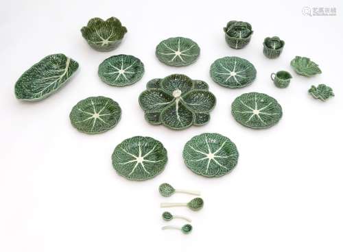 A quantity of assorted majolica cabbage / leaf plates,