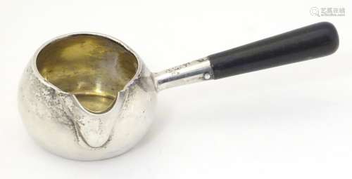 A Victorian silver brandy saucepan with spout, gilded