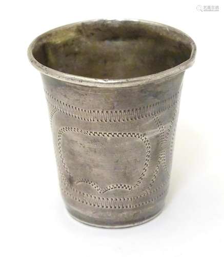 A silver vodka / tot cup with engraved decoration,