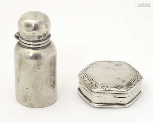 A miniature silver scent bottle with glass lining