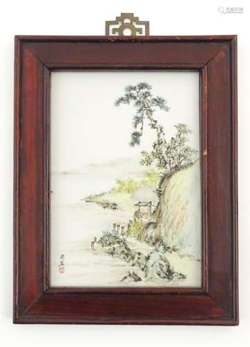 A Chinese porcelain plaque decorated with a coastal