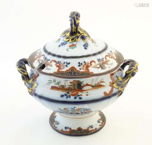 An ironstone twin handled pedestal tureen with stylised