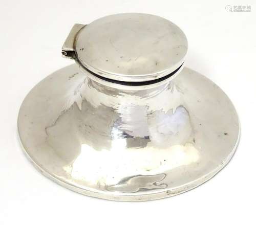 A silver inkwell of capstan form hallmarked Birmingham