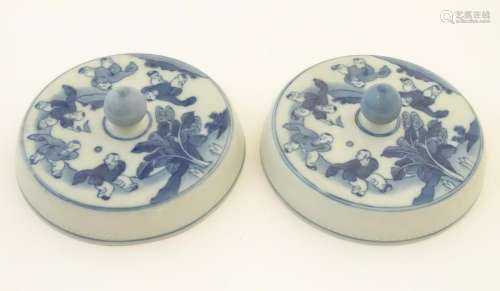 Two Chinese blue and white lids with figures in a