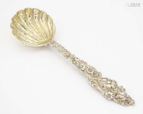 A Victorian silver gilt sifter spoon with cast