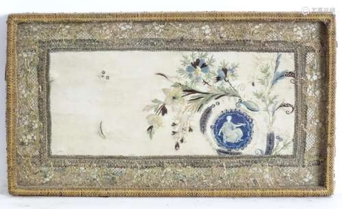 A 19thC needlework embroidery with flowers, foliage,