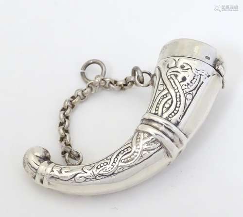 A silver vinaigrette formed as a Viking horn,