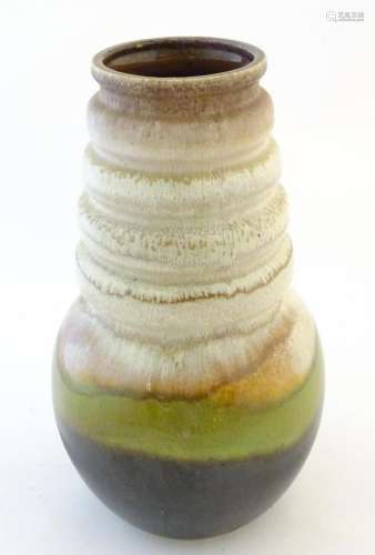 A large West German vase with a bulbous body and ribbed