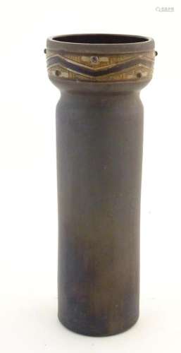 A tall studio pottery vase of cylindrical form with