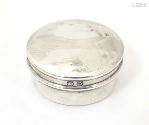 A silver pill box of circular form, hallmarked