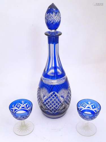 An early 20thC blue glass decanter, decorated with