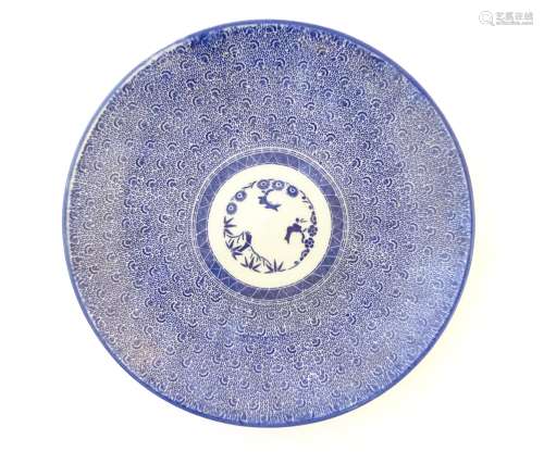 A Japanese blue and white sometsuke charger decorated