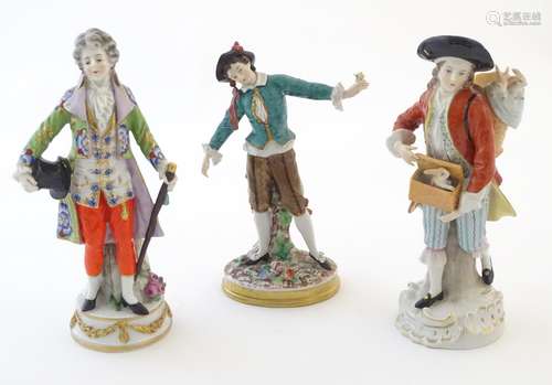 Three German figures comprising a gentleman with a top