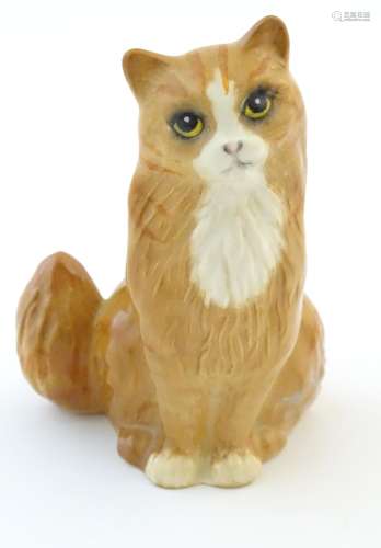 A Royal Doulton model of a seated cat. Marked under.