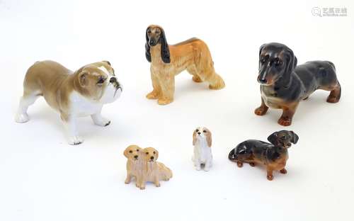 Five assorted Beswick dogs comprising Afghan Hound,