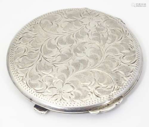 An American sterling silver compact with engraved