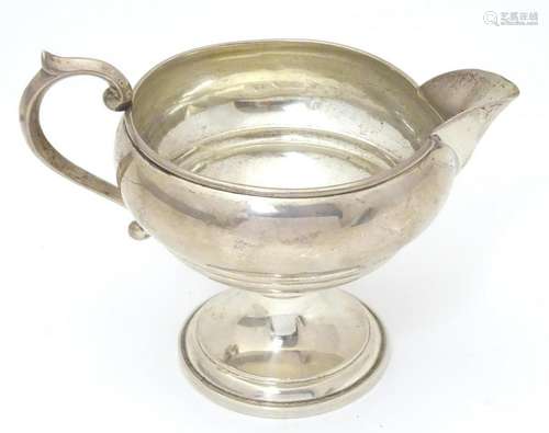 An American sterling silver pedestal cream jug. Maker