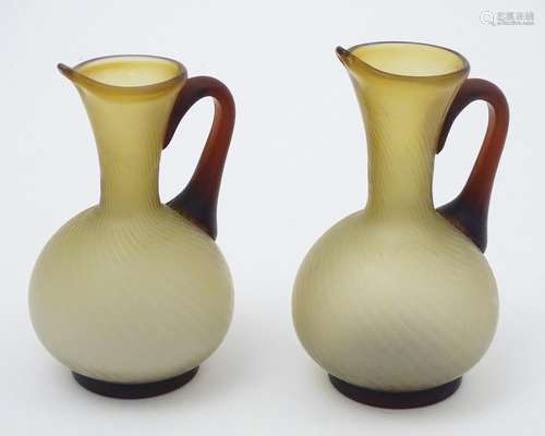 A pair of mid century retro brown and cream glass jugs