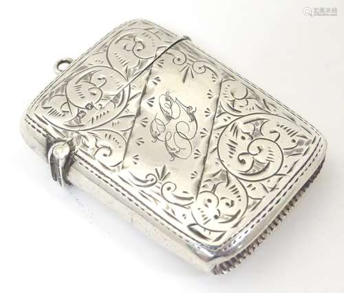 A Victorian silver vesta case with engraved decoration,