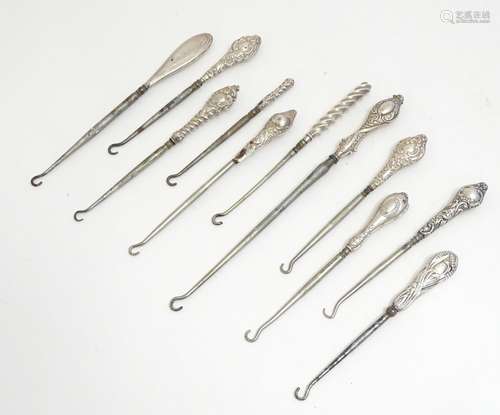 Eleven assorted silver handled button hooks, various