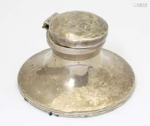 A silver inkwell of capstan form, hallmarked Birmingham