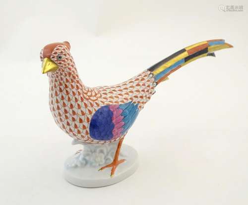 A Herend pottery model of a pheasant with fishnet