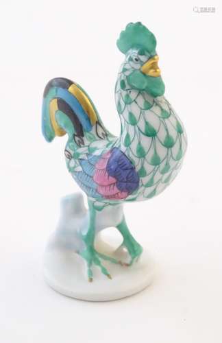 A Herend pottery model of a cockerel with fishnet