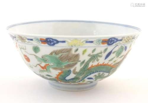 A Chinese bowl with dragon and flaming pearl detail,
