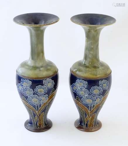 A pair of Royal Doulton vases with flared rims with a