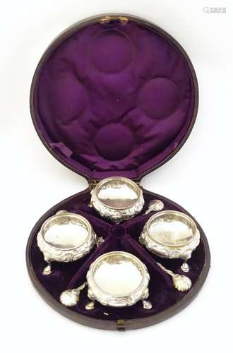 A cased set of four Victorian silver salts of circular