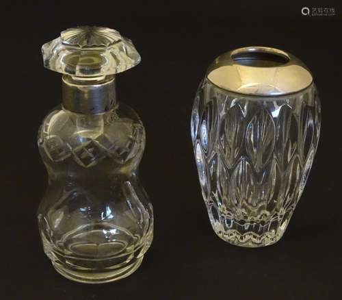 A cut glass scent / perfume bottle with silver collar