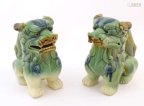 A matched pair of Chinese models of foo dogs / guardian