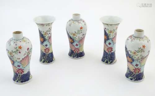 Five Chinese famille rose vases comprising two trumpet