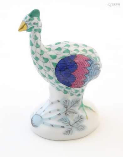 A Herend pottery model of a guinea fowl with fishnet