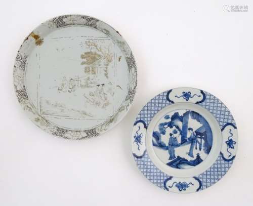 A Chinese blue and white plate decorated with two