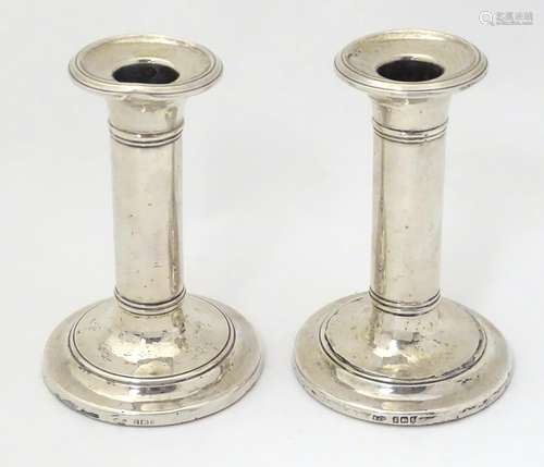 A pair of silver candlesticks, hallmarked Birmingham