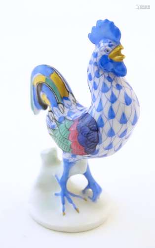 A Herend pottery model of a cockerel with fishnet