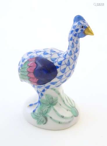 A Herend pottery model of a guinea fowl with fishnet