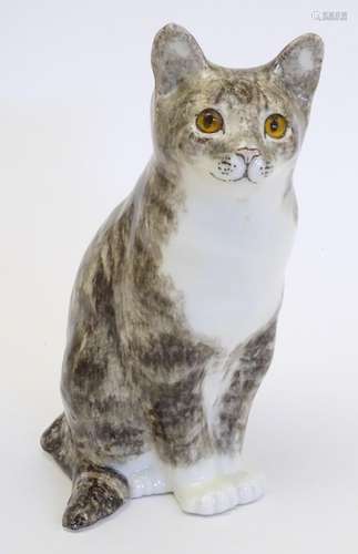 A large Winstanley model of a seated cat. Marked under,