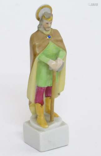 A Herend pottery figure modelled as a Saint. Marked