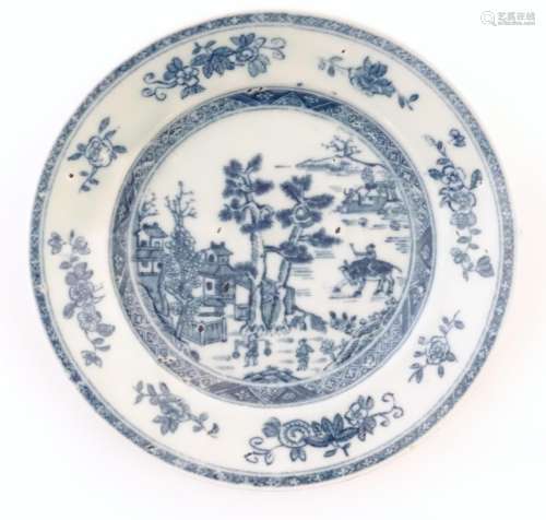 A Chinese blue and white plate depicting a landscape