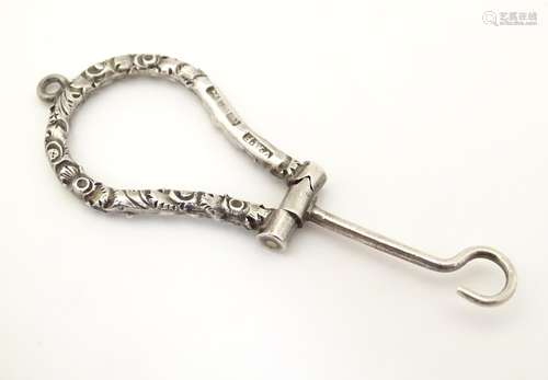 A Victorian silver folding button hook, hallmarked