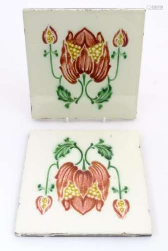 Two tiles decorated with stylised tulip / flower