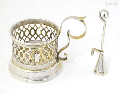 A silver candle holder hallmarked London 1900, maker