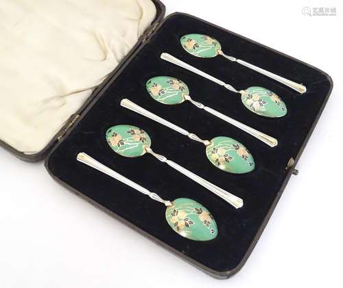 A cased set of six silver teaspoons with gilt and