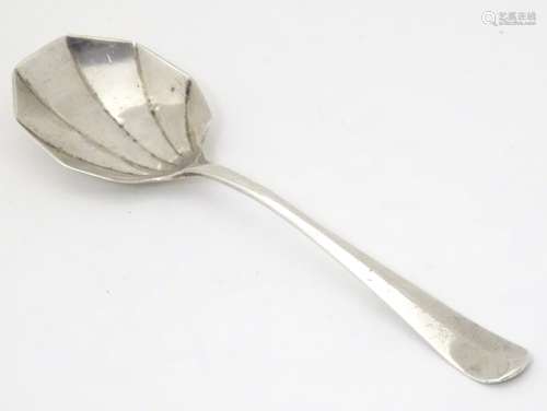 An Art Deco silver jam / preserve spoon with shaped