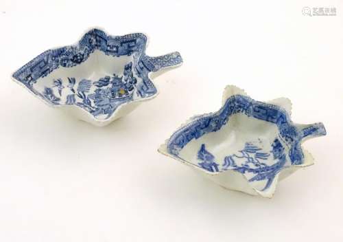 Two blue and white pickle dishes decorated with pagoda