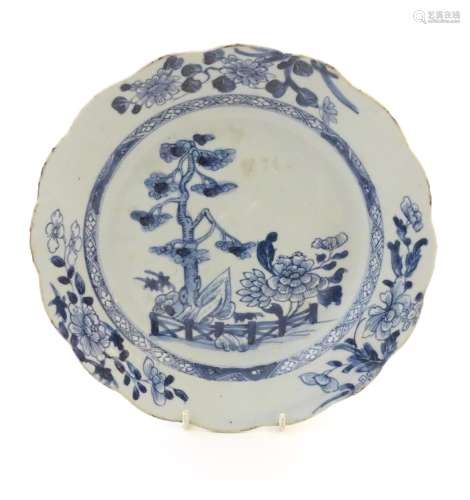 A Chinese blue and white plate with a lobed rim