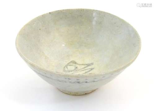 An Oriental earthenware bowl of tapering form with