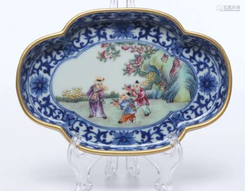CHINESE PORCELAIN BLUE AND WHITE FAMILLE ROSE BOY
